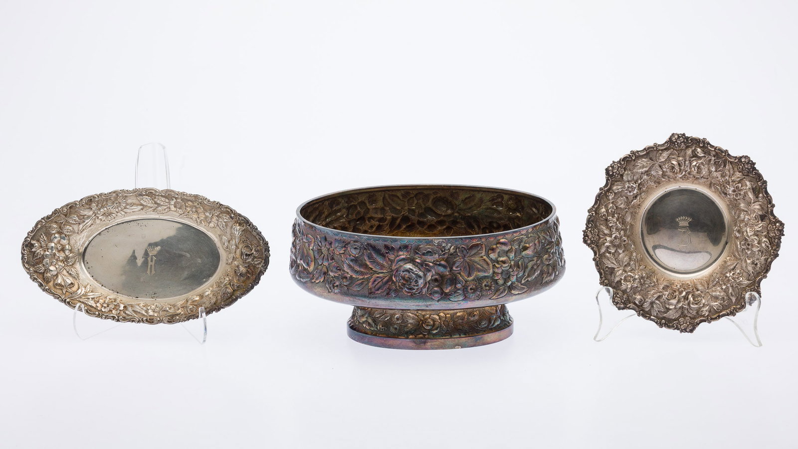 Whiting Sterling Centerpiece & 2 Repousse Plates: Property from a Private Collection, Savannah, GA Description: Whiting Sterling Repousse Oval Centerpiece Bowl and 2 Repousse Plates, comprising a Whiting centerpiece of oval form with footed base, a