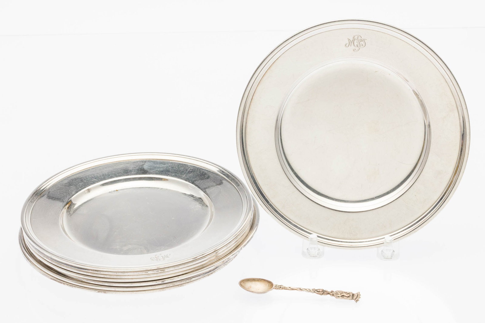 8 Tiffany Butter Plates and 18th C Spoon: Description: 8 Tiffany Butter Plates and 18th C Spoon, comprising 8 Tifanny sterling silver butter plates, dated between 1907-1947, monogrammed; and 18th C. English demitasse spoon by John Langlands