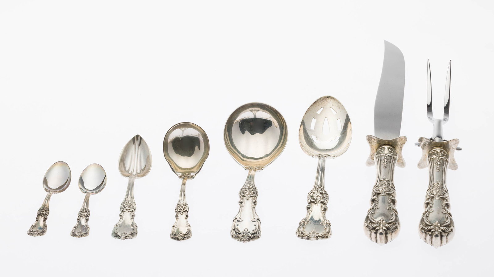 Group of Reed and Barton Serving Pieces: Property from a Private Collection, Savannah, GA Description: Group of Reed and Barton Serving Pieces, with ornate floral design on the handles, comprising carving knife, carving fork, ladle, small
