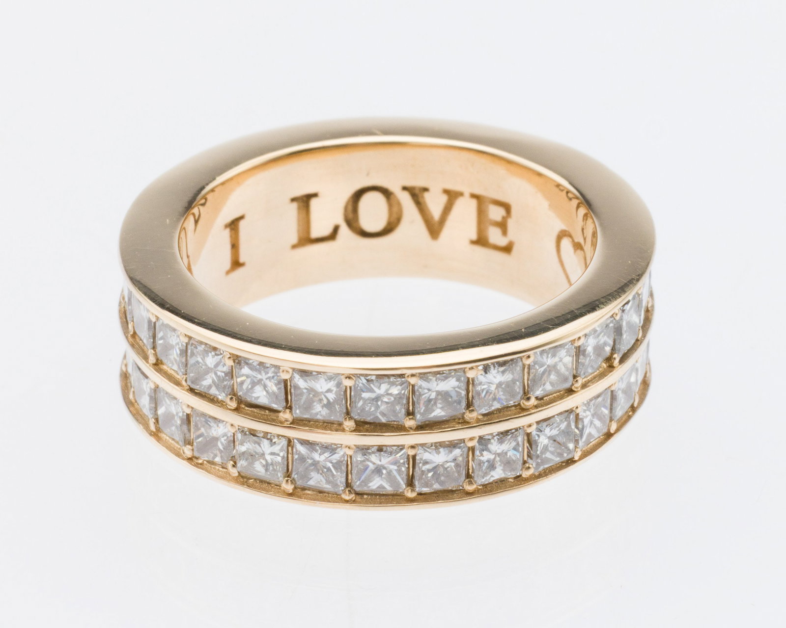 14K Double Diamond Infinity Band, Size 6.25: Description: 14K Double Diamond Infinity Band, Size 6.25, 14K yellow gold band featuring two rows of channel and bead set square cut diamonds (approx. 3.5 cts F-G VS), the inside engraved 'J.A.A. I Lo