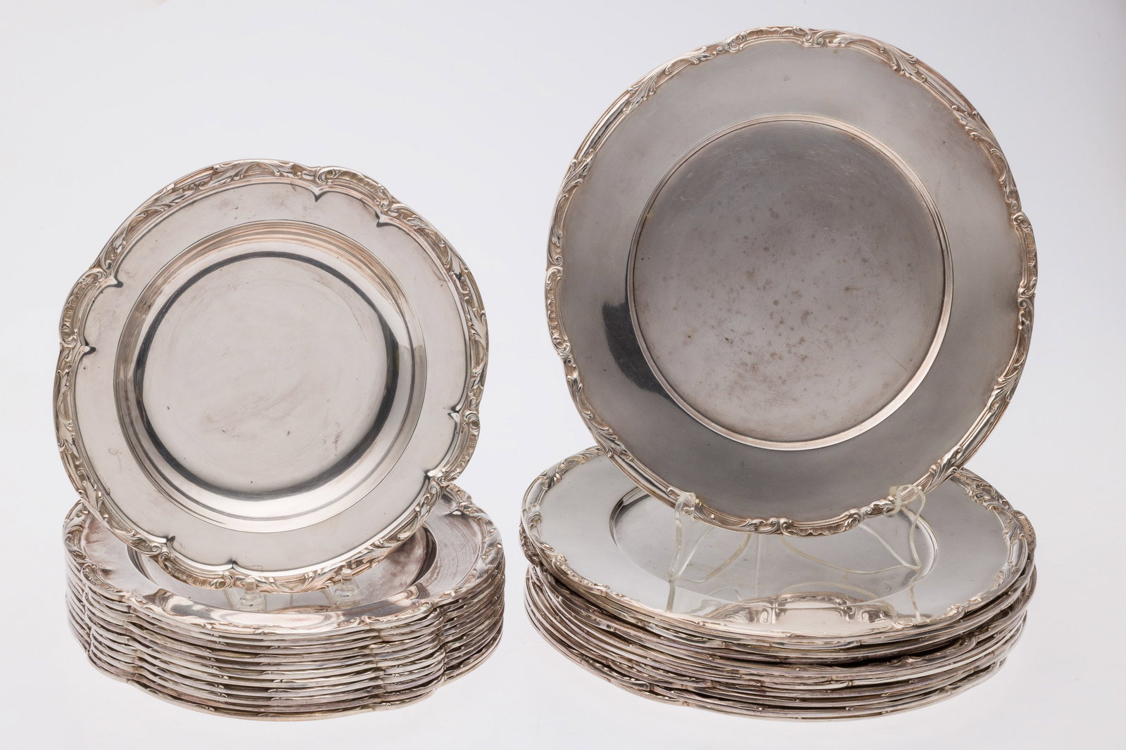 12 GM Co Silverplate Chargers & 12 Deeper Chargers: Property of a Private Collector, Jacksonville, FL Description: 12 G.M. Co Silverplate Chargers and 12 Soup Bowl Chargers, a set of twelve 10 5/8 in. silverplate chargers and twelve 8 7/8 in. soup bowl