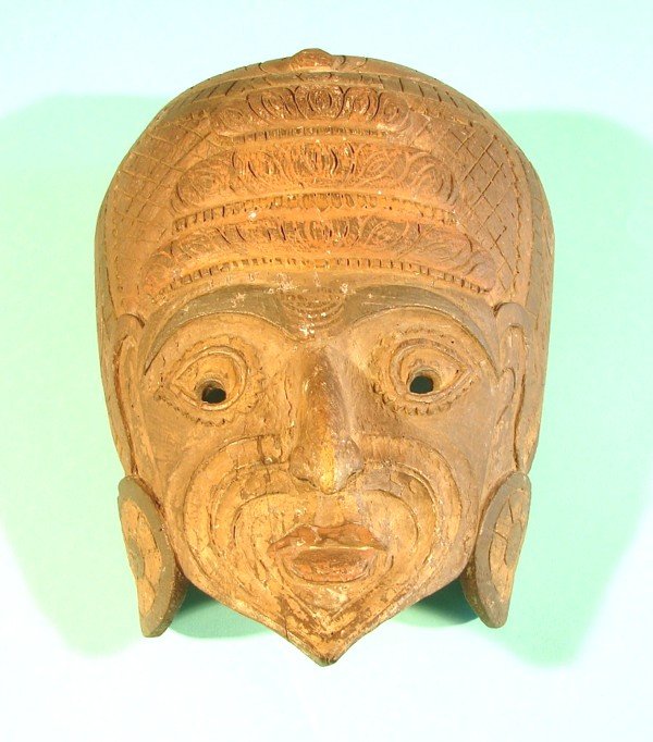 A Southeast Asian hand carved and painted wood mas