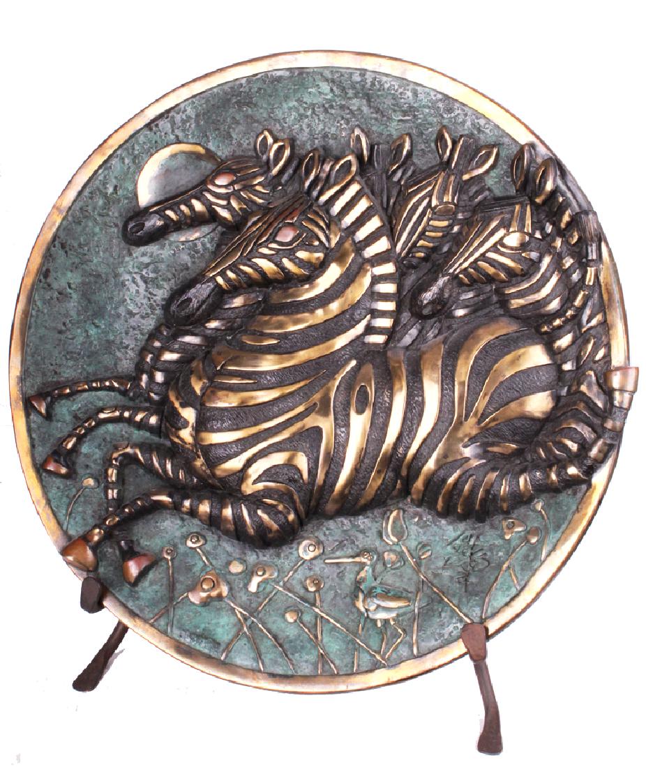Tiefeng Jiang (b. 1938) Chinese: ZEBRAS, 1995, polished and patinated cast bronze sculpture, signed, numbered 10/225, published by Fingerhut Group, with their stamp, Valley Bronze Inc. Foundry, 18” diameter. Provenance: Fingerhut G