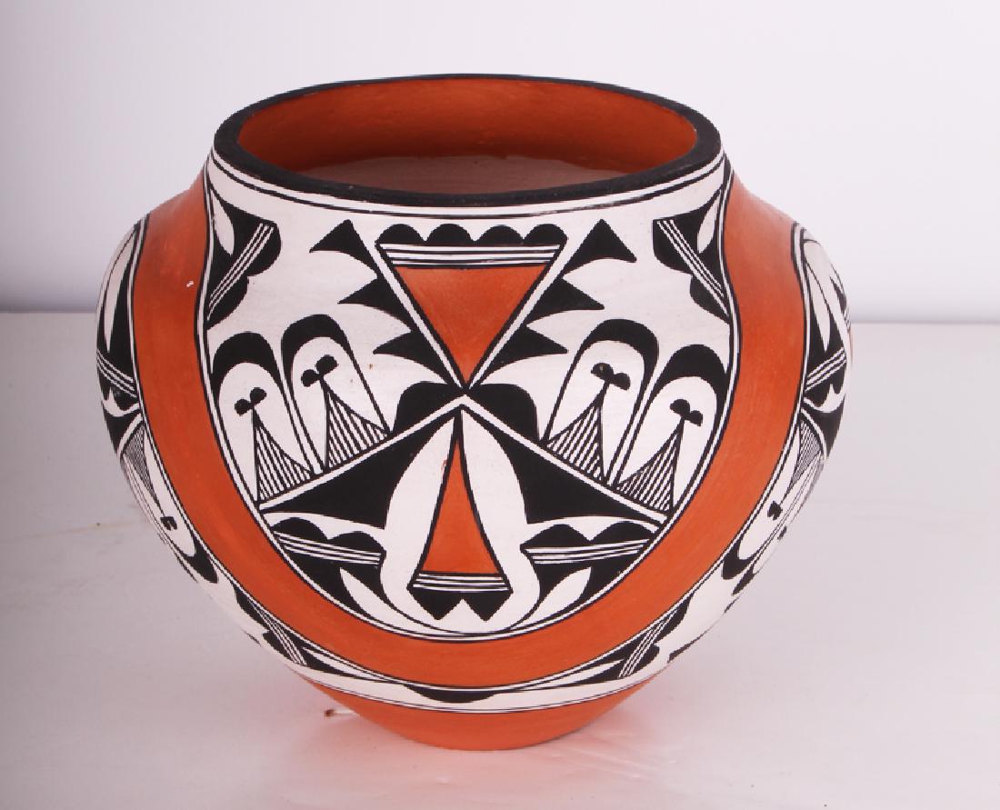 Acoma Pottery by Florence Aragon (1929-2010) New Mexico: Painted ceramic vessel, signed underneath, 5 ½ tall, 6 ½” diameter.