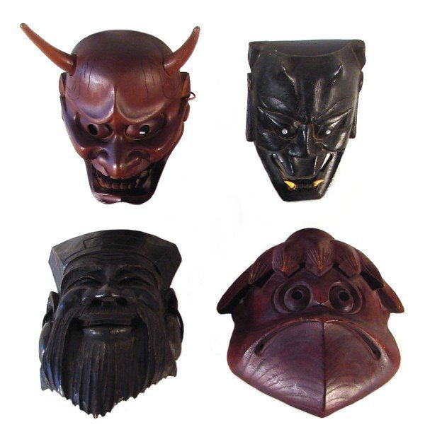 Asian Masks (four): MASAMITSU MASK, a hand carved and painted wood mask, signed "Mr. Masamitsu" inside, 10" tall, 6" wide, small chips; Together with FACE WITH LARGE EYES AND INLAID TEETH, a hand carved wood mask, 7" tal