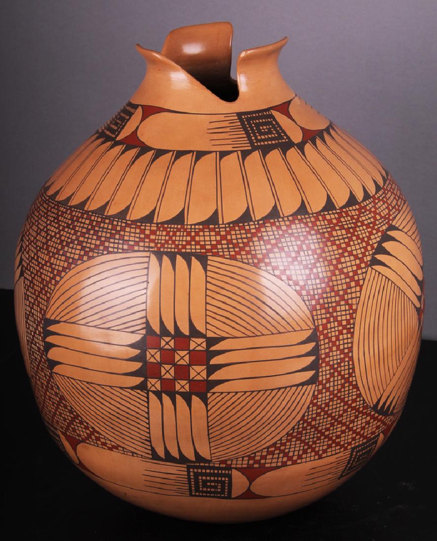 Southwestern Art: Cesar Bugarini (20 th Century) Mata: Painted ceramic vessel with flared opening and rounded bottom with tradition motif, signed underneath, 17â€ tall, 15â€ diameter.