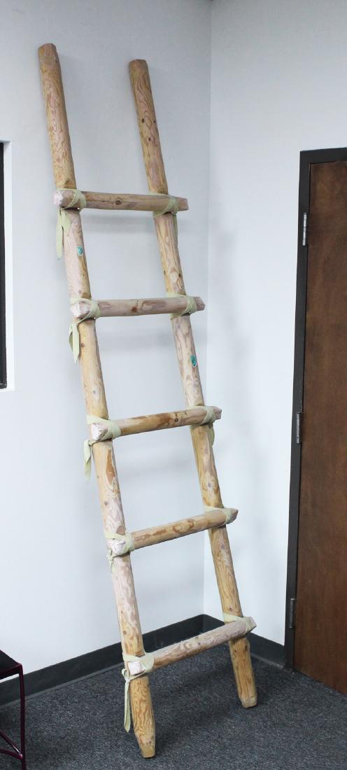 Southwestern Art: Decorative Ladder (20 th Century): A five-rung wood ladder of sanded logs with leather strapping and turquoise insets, overall 97 x 24 x 4â€, not climbing.