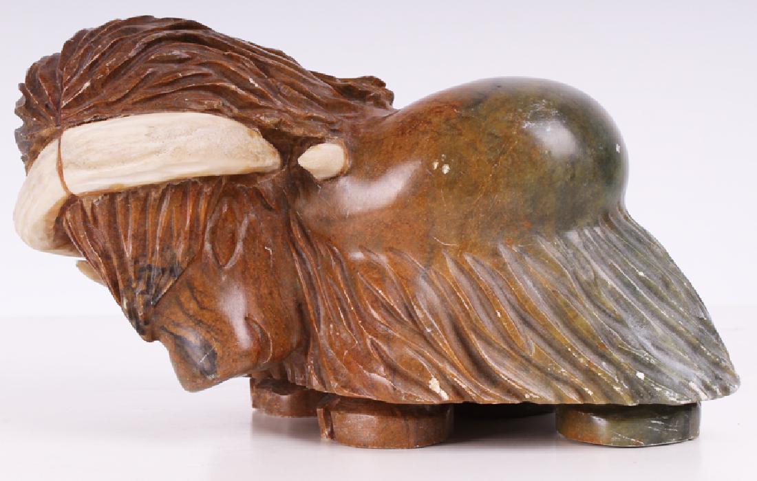 Muckpah Shytoo (b. 1956) Canadian Inuit: WATER BUFFALO, 1992, carved soapstone sculpture, signed and dated underneath, 5 ½ x 9 ¾ x 6 ½”.