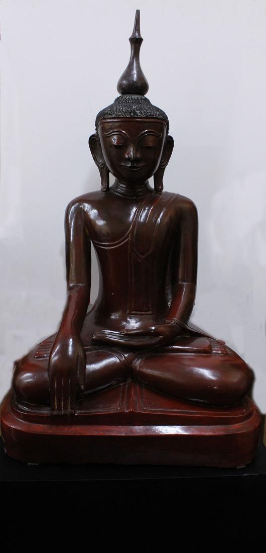 Asian Decorative Art: Buddha Statue: SEATED BUDDHA, carved and painted wood statue with removable nob, with small amounts gold leaf or paint remnants, 59 ¼” tall, with painted wood stand 15 x 37 x 25”, overall 74 ½” tall. From th