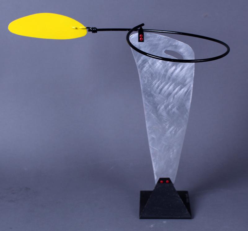 Brad Howe (b. 1959) California: BALANCING YELLOW TAIL SWIRL, stainless steel and painted metal sculpture, signed, 15 ½ x 16 ½ x 9”. Acquired directly from artist by current owner.