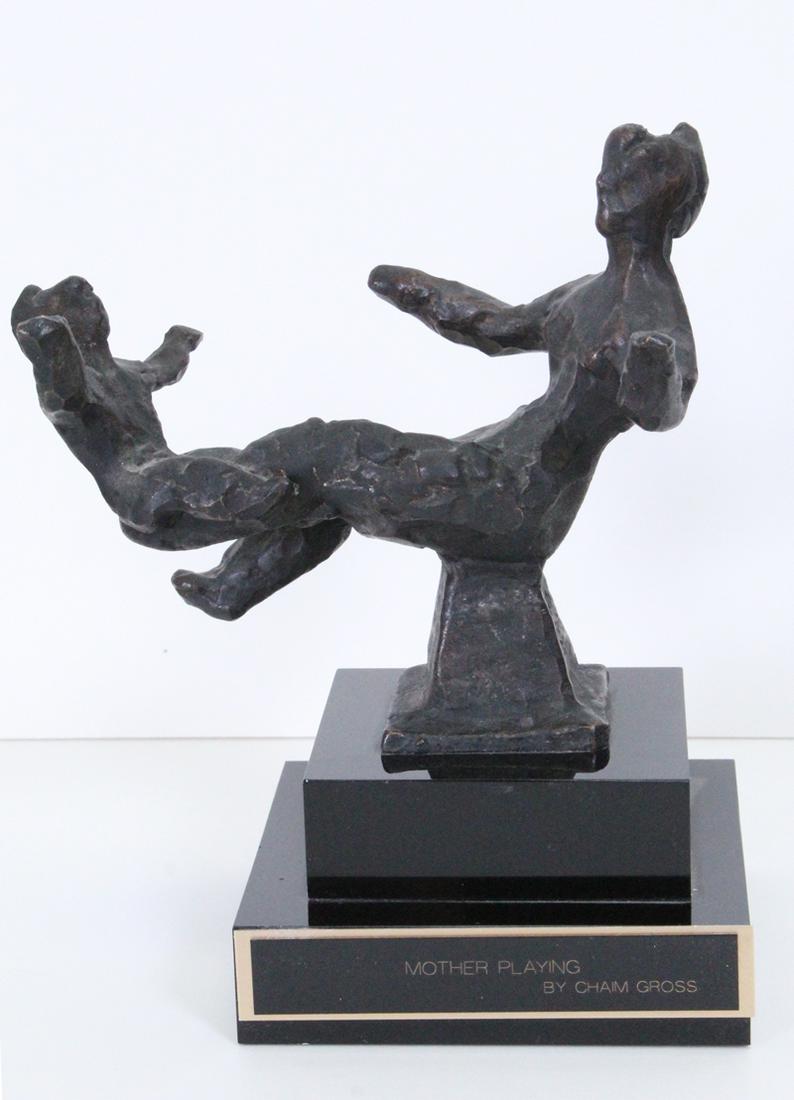 Chaim Gross (1904-1991) New York: MOTHER & CHILD, cast bronze sculpture with multi-tier stand, signed, overall 7 ¼ x 6 x 4”.