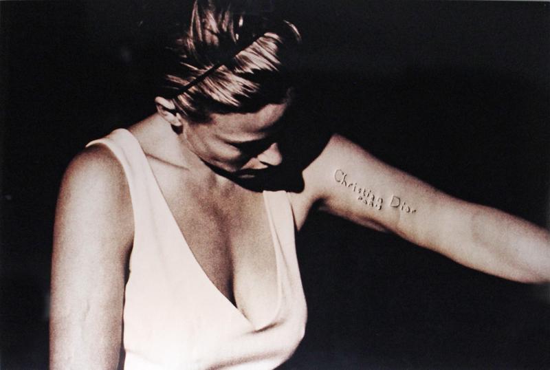 Daniele Buetti (b. 1955) Swiss: MADONNA (Christian Dior), from Looking for Love Series, 1997, altered photograph on aluminum, signed and dated and inscribed on verso, edition 1/3, 40 x 59 ½”. Provenance: ACE Gallery, Los