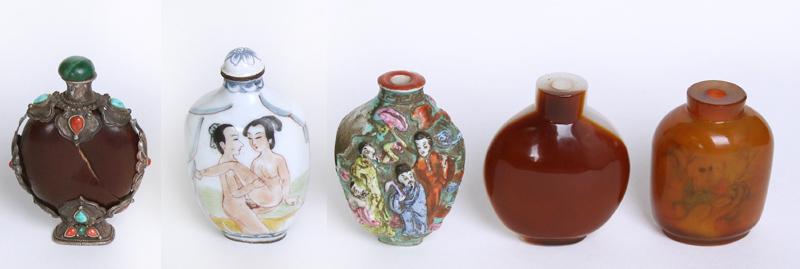 Chinese Snuff Bottles (five): Five snuff bottles: A seed pod bottle with metal casing with inlaid stones and cap; An erotic painted porcelain bottle with cap, signed; one stone bottle and one amber glass bottle with reverse painti