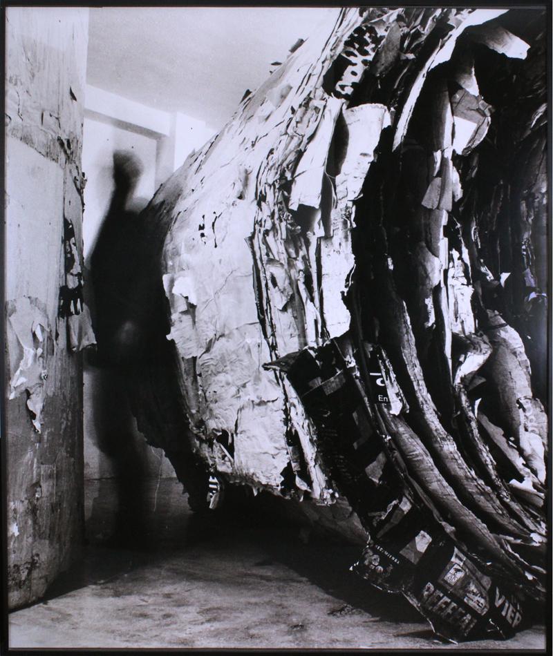 Santiago Sierra (b. 1966) Spanish: DOCUMENTATION OF TWO 8 x 8 FT CYLINDERS OF TORN POSTERS, 1994, c-print probably mounted to Centrex, edition 2/5, frame 73 x 60 ½”. Provenance: ACE Gallery, Los Angeles, with copy of artist's COA; G