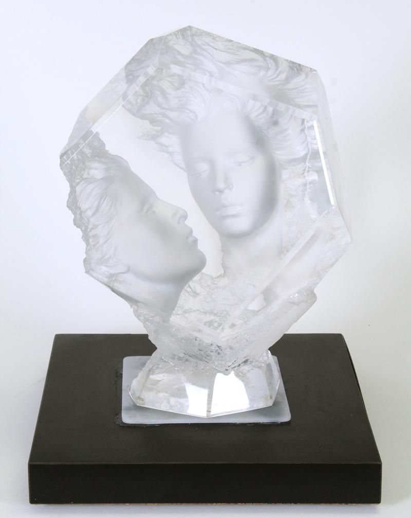 Michael Wilkinson (b. 1954) California New York: THE VOW, 2003, cast Lucite sculpture, signed and numbered 130/600, 14 x 10 x 7”, with a custom-made Formica swivel base.