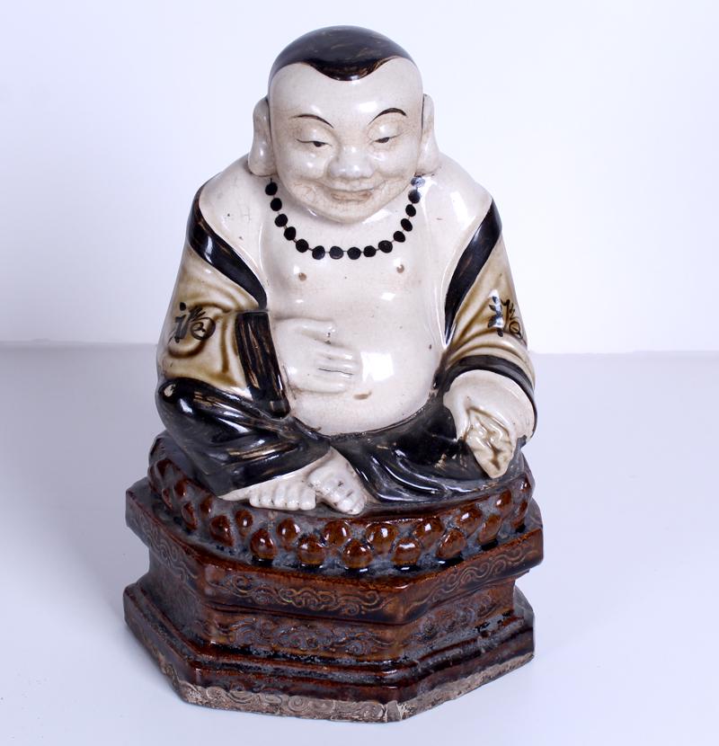 Antique Chinese Buddha: Buddha seated on lotus flower of great age, glazed earthenware of two adjoined pieces overall 11 ½ x 8 x 6”.