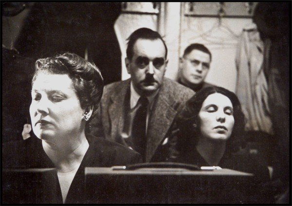 W. Eugene Smith (1918-1978) American: LISTENING TO A PLAYBACK AT THE MET, vintage silver gelatin print, artist's stamps on verso, 9 ½ x 13 ½", mounted to 20 x 16" card, tear in card lower right far away from image, otherwise in good con