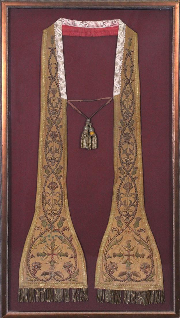Liturgical Garments or Vestments: STOLE or EPITRACHELION, embroidered fabric with lace collar, sight 39”, frame 44 x 24” with glass. From the collection of Chevalier Tony Clark.
