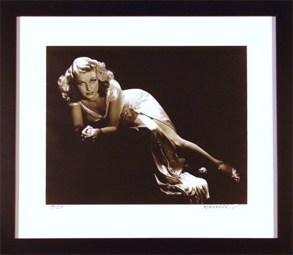 George Hurrell (1904-1992) American: ANN SHERIDAN, gelatin silver print, signed in ink, from the numbered edition 25, sheet 16 x 20", created especially for the publisher aside from the numbered edition of 250, mild cockling.