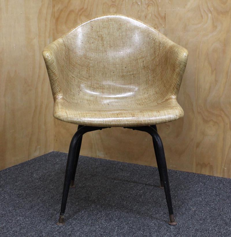Furniture: Eames-style chair: Fiberglass swivel bucket armchair in the style of Herman Miller Co., lacquered twine over fiberglass body with metal leg assembly, 32 x 22 ½ x 23”.