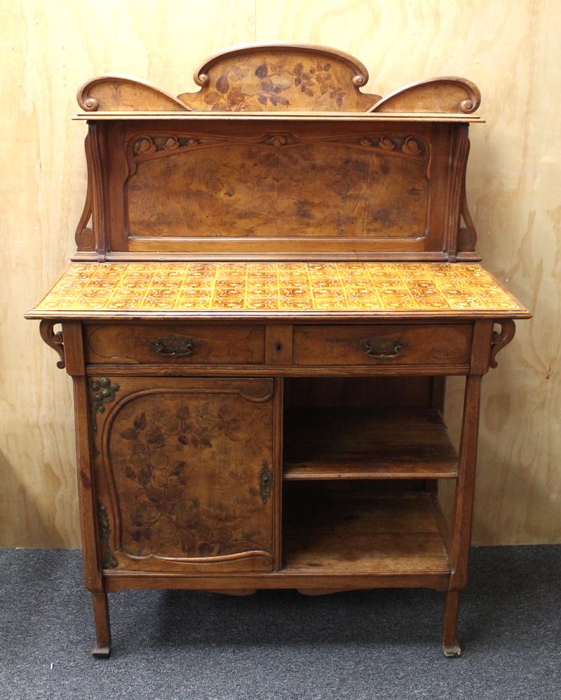 Furniture: Scottish Art Nouveau Buffet: Dessert Buffet, carved and veneered wood with ceramic floral tile inlay, two drawers and one locking door (missing key), top is removable for transportation, 62 x 45 ½ x 19”. Purchased in Edinburgh