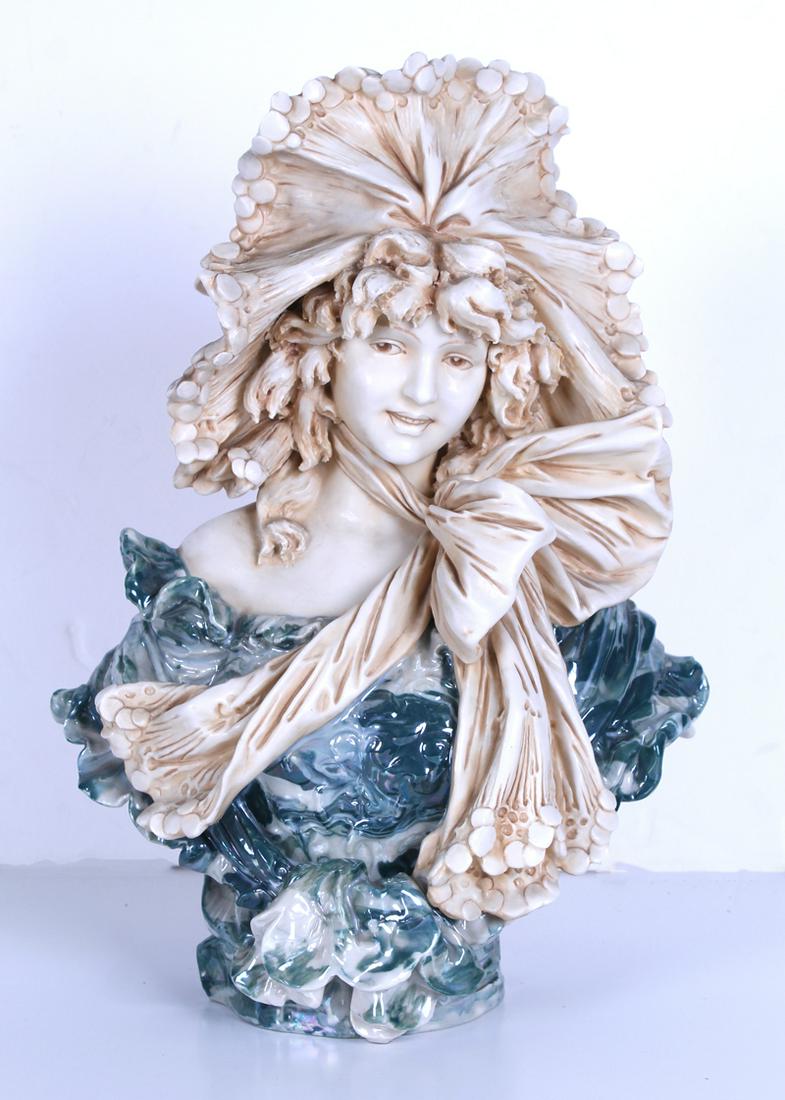 Royal Dux Art Nouveau Porcelain: BUST OF A MAIDEN, painted and glazed porcelain bust, hallmarked underneath, 14 x 10 ½ x 6”.