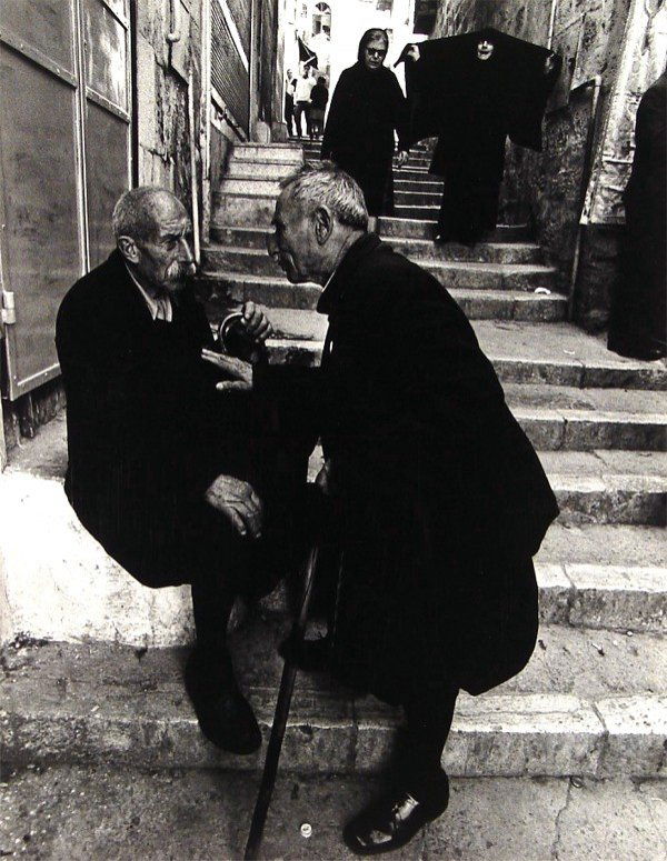 Micha Bar-Am (b. 1930) Israeli: MICHA BAR-AM, IN A JERUSALEM ALLEY, 1981, silver gelatin print, 20 x 16", from the numbered edition of 300, signed in ink.