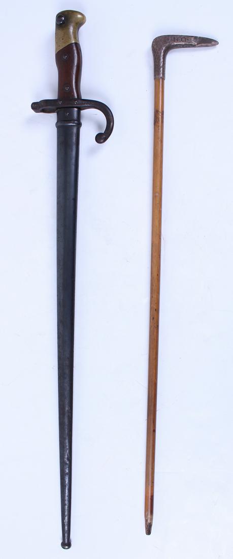 Bayonet Military Sword & Pointer with Sterling Silver: Bayonet sword with sheaf, stamped H98760 on sheaf & P15634 on bayonet, 26” long; Together with a wood pointer with a sterling silver handle, stamped HO, 23 ½” long.