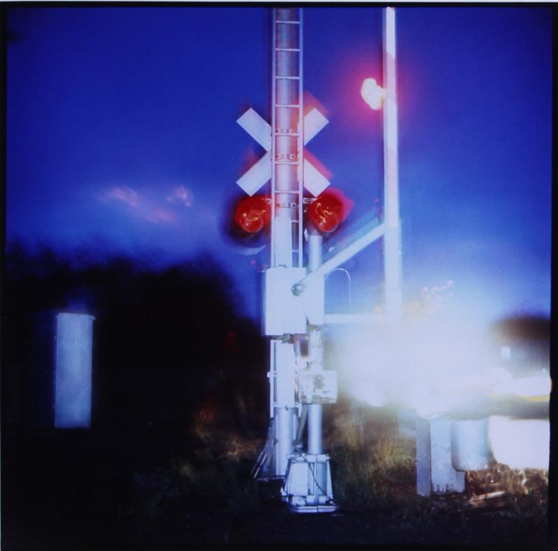 Steve Fitch (b. 1949) American: RAILROAD CROSSING GUARD, 1978, Cibachrome, signed and dated in pencil on verso, 16 ¼ x 13 ½”.