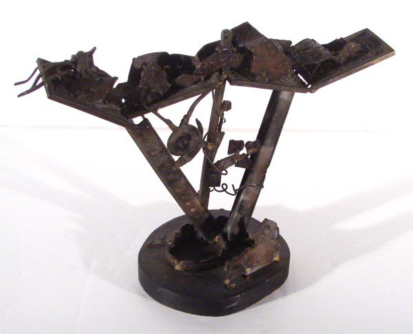 Nat Werner (1908-1991) American: MOLLIE BLOOMS SOLILOQUY, found object metal sculpture, 14 ½" tall including wood base, 19 ½" wide, 8 ½" deep.