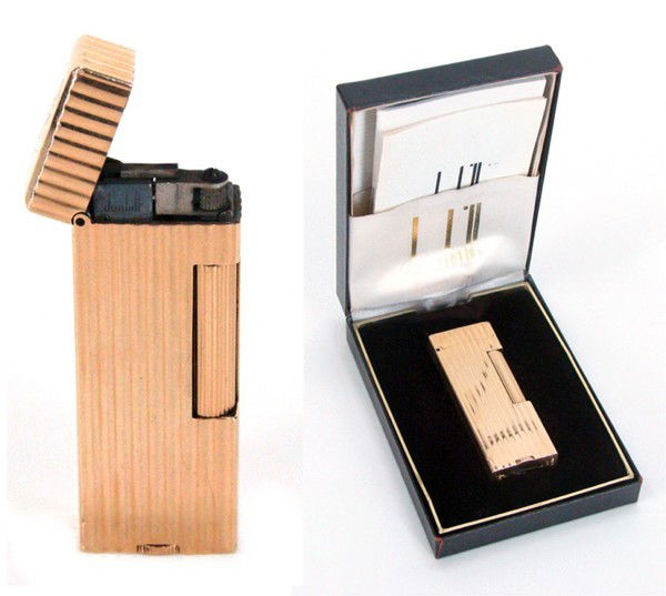 Decorative Arts: Dunhill 14 Karat yellow gold Cigar: Artist: Decorative Arts: Dunhill 14 Karat yellow gold Cigarette Lighter with original case 14 karat yellow gold Dunhill Rollagas Rulerlite & Wheatsheaf Lighter with ribbed design, stamped "Dunhill" an