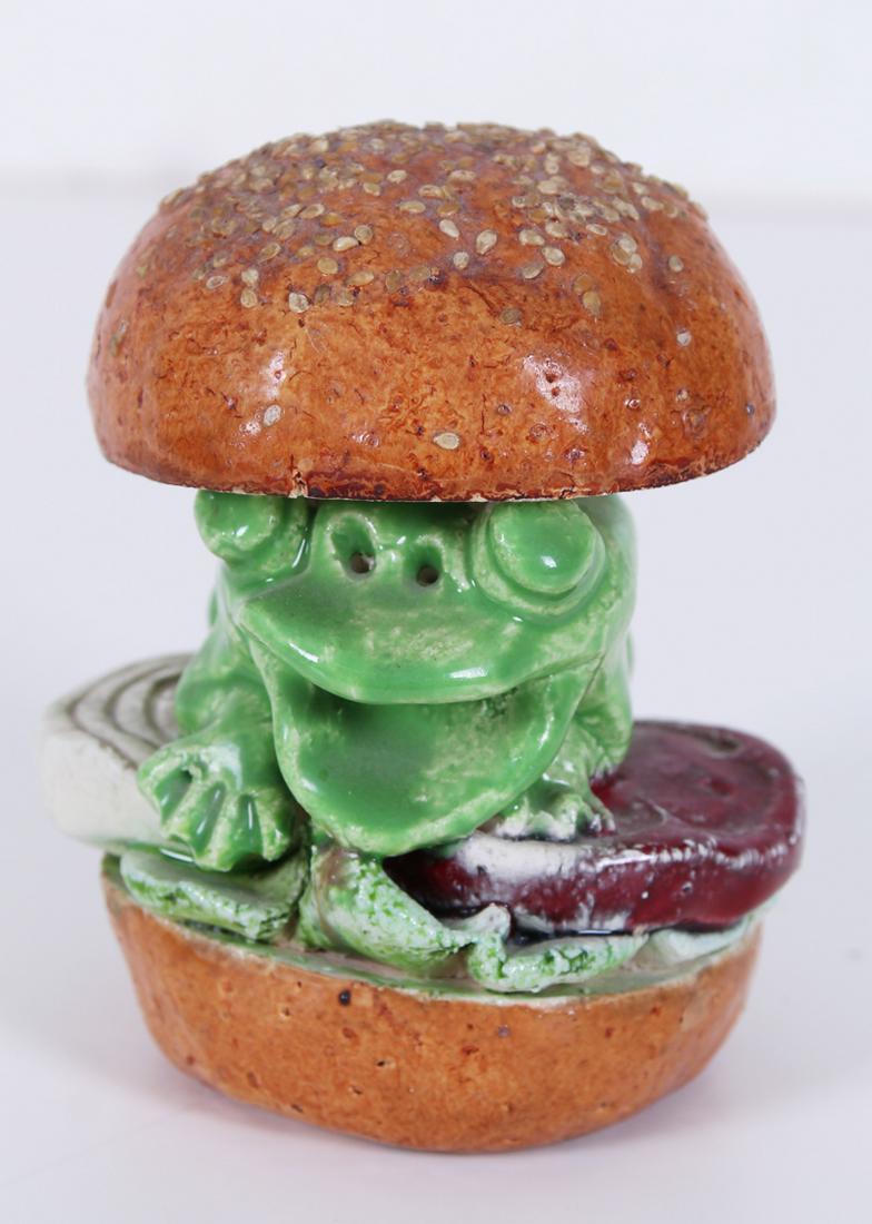 David Gilhooly (1943-2013) American: FROG BURGER, 1977, painted and glazed ceramic, signed and dated underneath, 4 ¾” tall.