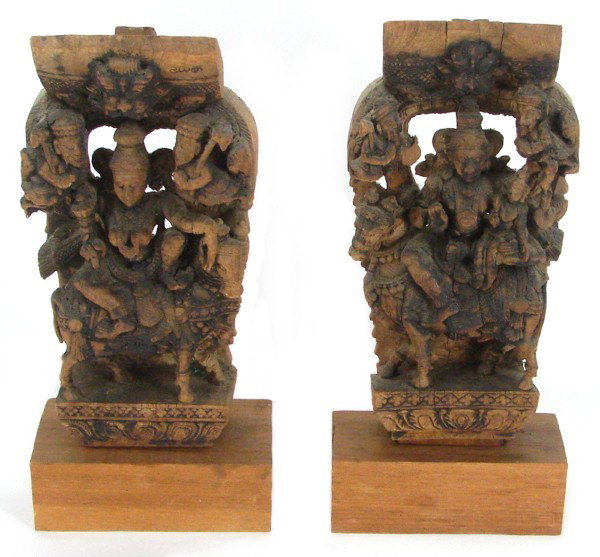 Southeast Asian Statues (two): WARRIORS, a pair of ornately carved architectural fragment wood reliefs, both inscribed, each 14 ½" tall 7" wide, both on wood bases, some wear and cracking, otherwise in good antique condition. (2)