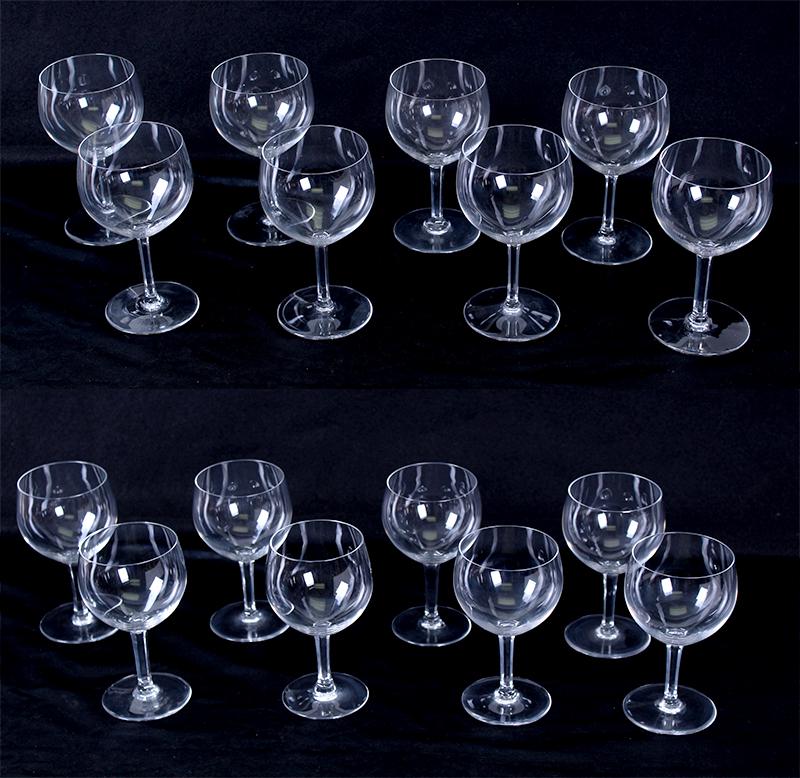 Baccarat Crystal (sixteen): Eight 6” tall watercolor goblets and eight 5 ½” tall Claret wine glasses with Rabelais pattern. (16)