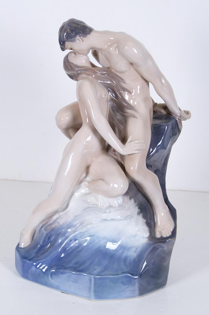 Royal Copenhagen after Theodor Lundberg (1852-1926): WAVE AND ROCK, monumental painted and glazed porcelain statue, 1897 hallmark on backside, hallmarked and numbered 1132 underneath, 18 x 12 x 11 ½”, weight 16 lbs.