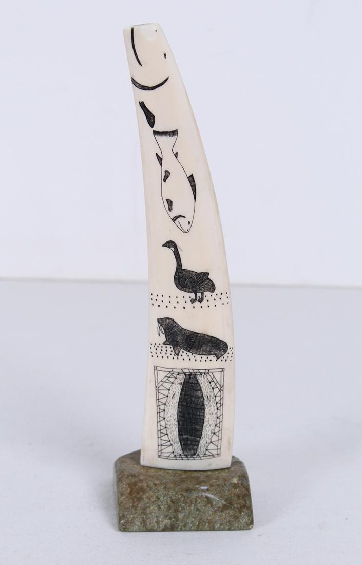 Inuit or Northwest Coast Artist (20 th Century): Carved and ink narrative with stone base, overall 10” tall. Provenance: Diana Zlotnick Collection, purchased from Canadian Craftâ€™s Guild.