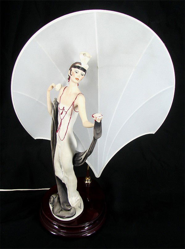 Guiseppi Armani (20th Century) Italian: FLAPPER LAMP, 1987, cast and painted acrylic lamp with fabric shade, stamped, flapper 18" tall, shade 21" tall including pole, 21" wide, with wood base, surface soiling, losses of compact top and fing