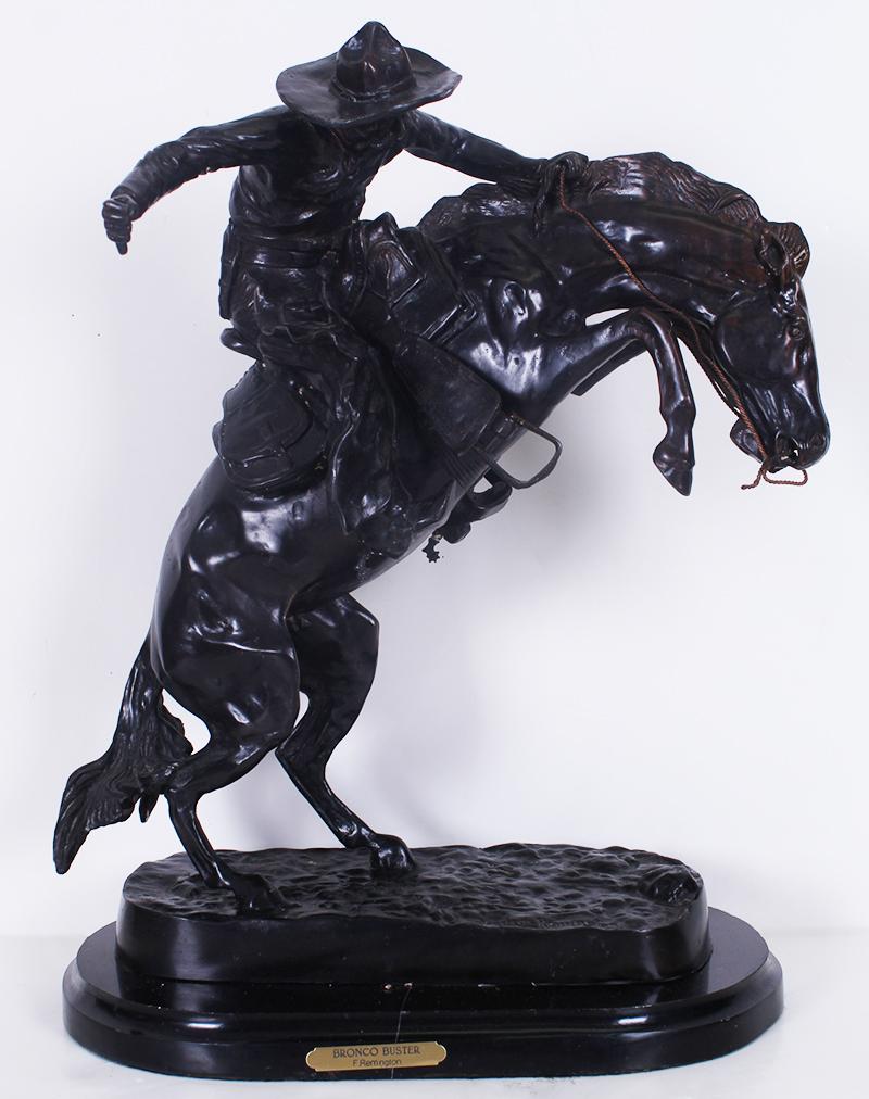after Frederic Remington (1861-1909) American: BRONCO BUSTER, cast bronze sculpture with dark patina, signed in design, with marble base overall 22 ½ x 18 x 13”, weight 45 lbs.