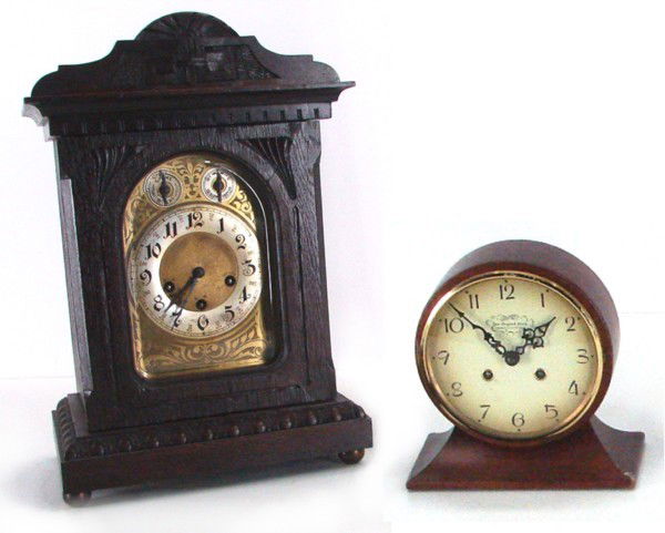 Continental Mantle & Wall Clocks (two): Large Unghans J. B.06, mantle clock with wood case and brass face, with pendulum, 18” x 12” x 8”, with key; Together with a small American mantel clock manufactured by New England Farmington. Co