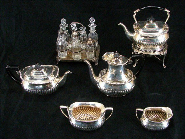 Decorative Arts: Sterling Silver: Sterling Silver Ware: Coffee & Tea Service: kettle with stand, (stamped E & Cold underneath), ribbing bent with a few broken; coffee pot, tea pot, creamer and sugar, tallest 12”, all same design wit