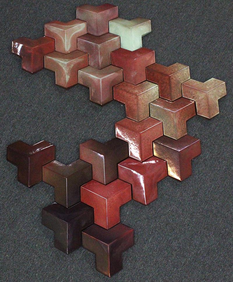 Contemporary Artist Unidentified: UNTITLED, installation of twenty-one pieces of enameled ceramic elements, a signature not found, overall 82 x 66” in layout as purchased, variations possible as one may chose, each element 14 x 