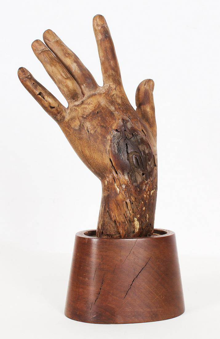 Buddhist Wood Hand: Carved wooden hand with a wood stand, overall 11 ½” tall.