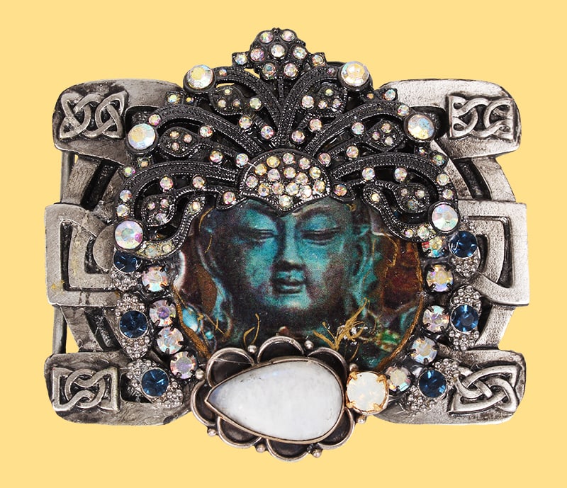 Shayna Saide La Beouf (1942-2022) New York California: BUDDHA, hand-made mixed media metal belt buckle with collaged image, applique, rhinestones and faux or semi-precious stones, signed on back, size 3 x 3 ½”, with 5 ½ x 4 x 1 ½