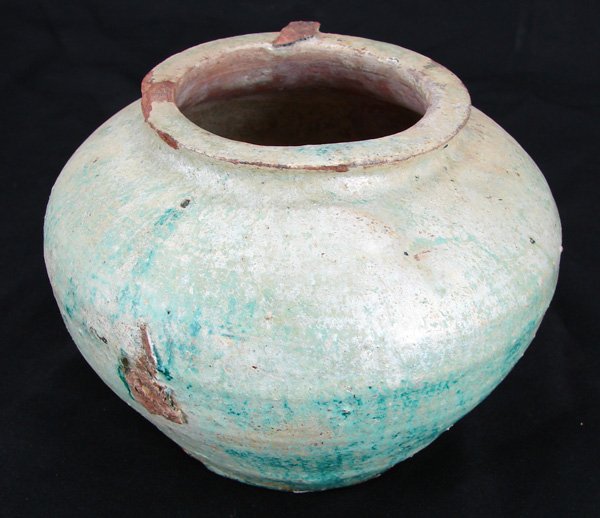 Decorative Item: Asian Ceramic: Han Dynasty Descendent Jar with green iridescent glaze, 5” tall, 7” diameter, small losses, otherwise in good condition.