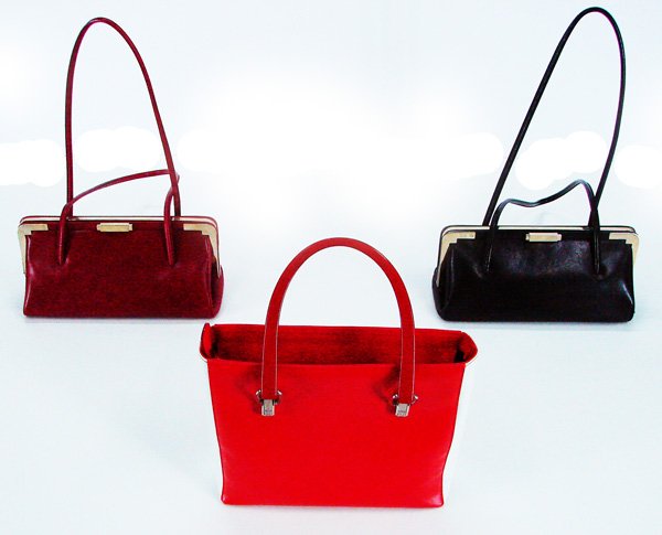 Fashion: Escada purses (three): Escada red and cream leather handbag with plastic handles, 8 ½ x 10 ½ x 4”; a black leather purse and a red leather purse both with leather handles, both 5 x 11 x 5” , all three with the Escada