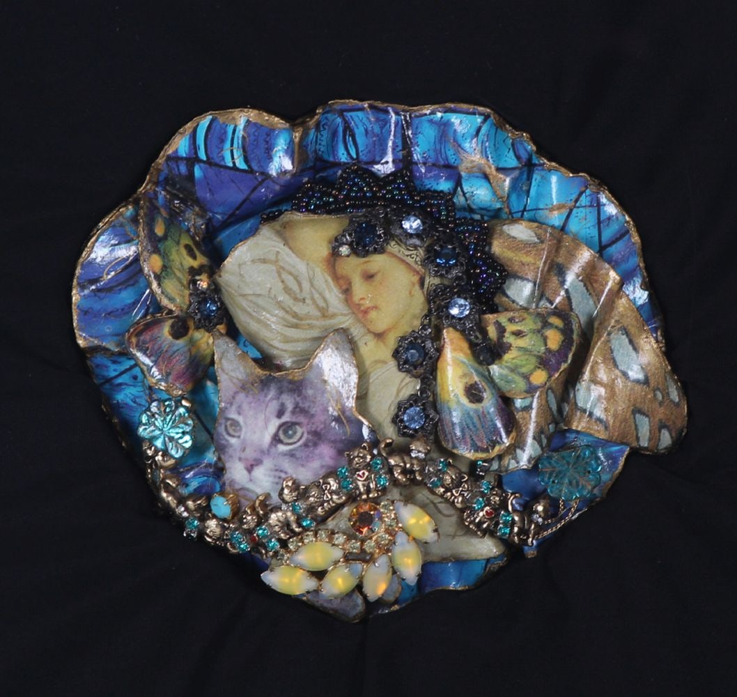 Shayna Saide La Beouf (1942-2022) New York California: SQUEEZIE MY SACRED CAT, one of a kind mixed media collage, signed and titled and dated on verso of artist designed frame 15 ½ x 15 ½ x 2 ¾”.