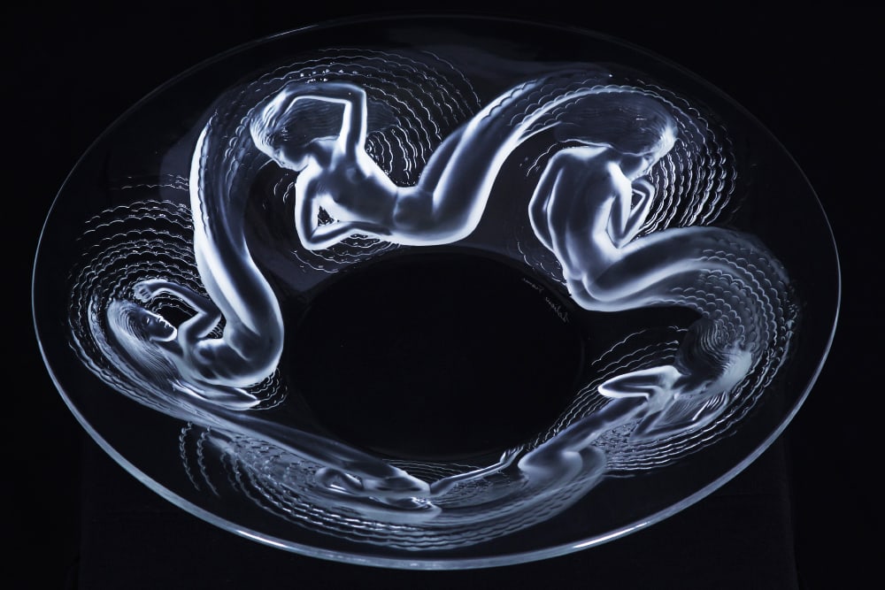 Lalique Crystal: CALYPSO BOWL (see 10381), glass bowl with raised and frosted stylized mermaids, signed Lalique France, 14 1/8” diameter, 2 5/8” tall.
