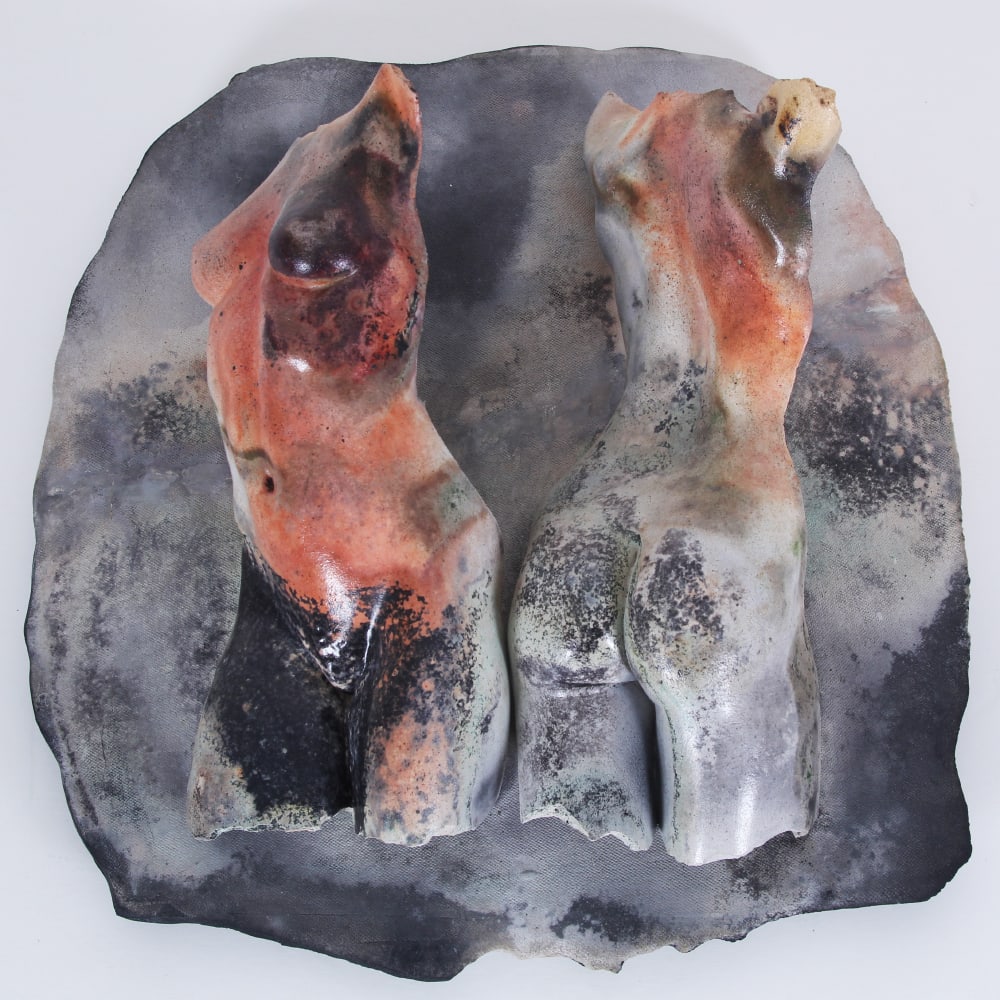 Tanya Ragir (b. 1955) Venice Beach: TWO TORSOS, saggar fired ceramic wall sculpture, a signature not found, 17 x 6 x 16 ½”.