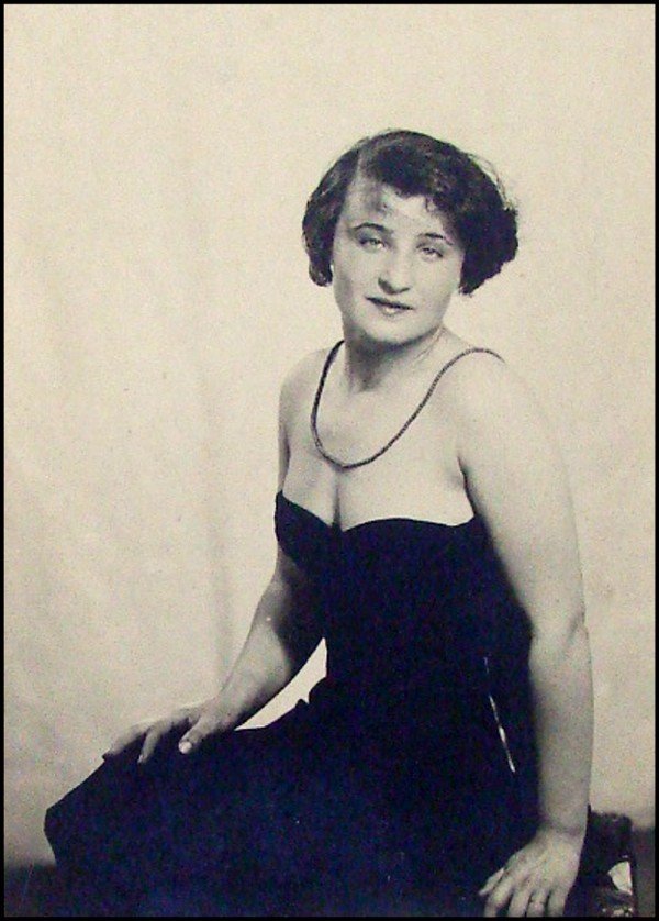 Man Ray (1890-1976) American: PHOTOGRAPHY OF A WOMAN, gelatin silver print, 3 x 2 ¼”, mounted to card stock by artist, with artist’s stamp on verso and inscribed Lena Huisel or Ansel in blue pencil, overall 5 ½ x 3 ½”, so