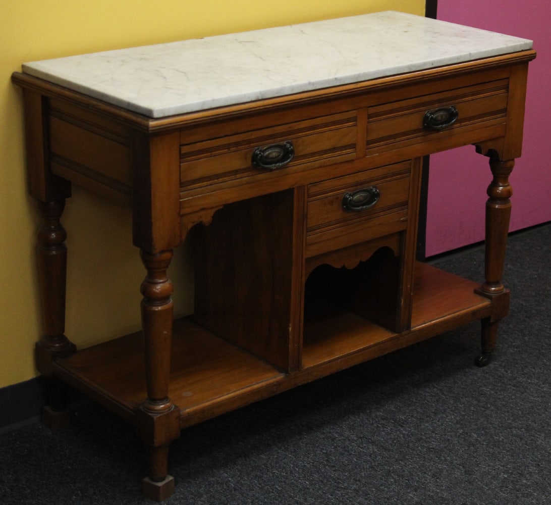 Antique Credenza (late 19 th / early 20th Century): Hardwood credenza with marble top, 31” tall, 40” long, 16 ¾” deep, with two of four wheels.